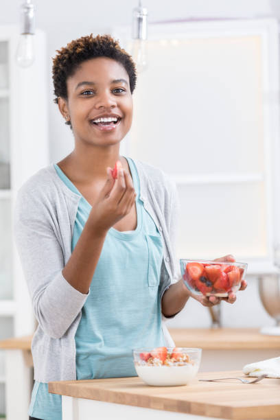 istock Woman eats a healthy breakfast 899406642