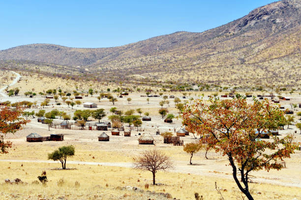 View over a traditional African Himba village with huts near Opuwo,Namibia.