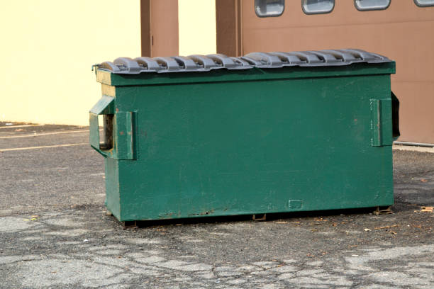 istock Industrial Garbage Bin in front of industrial building 899414972