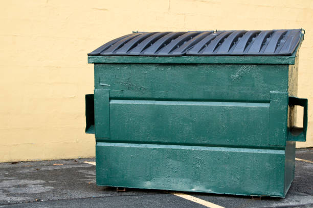 istock Small Industrial Garbage Bin in front of industrial building 899414976