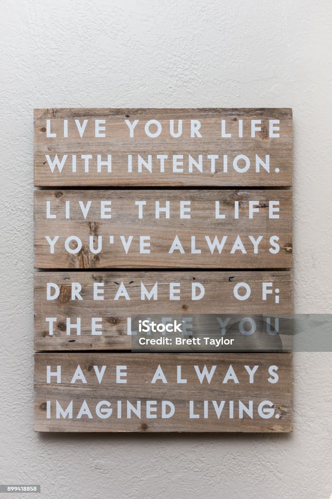 Wooden wall art Live your life with intention.  Live the life you've always dreamed of; the life you have always imagined living. Lifestyles Stock Photo