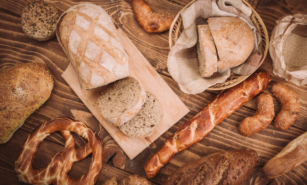istock Many mixed baked breads and rolls on rustic wooden table 899419096