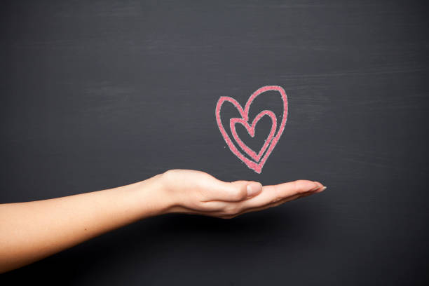 istock Human hand holding Valentines day 899419968