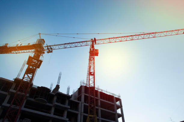 istock construction site,crane in city at sunny day 899422500