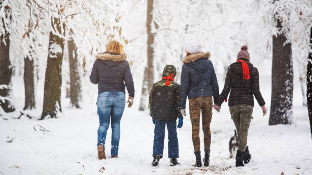 istock Family enjoying in snow 899434396