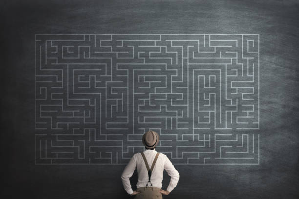 istock man try to solve a labyring on a chalkboard 899434516