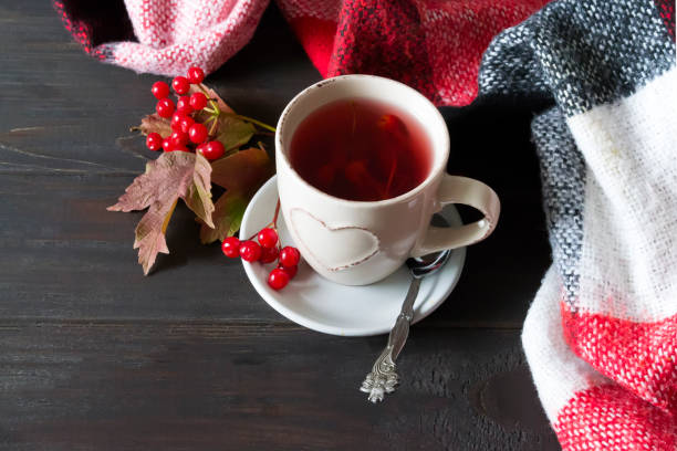 istock cup of hot tea with viburnum berries 899434536