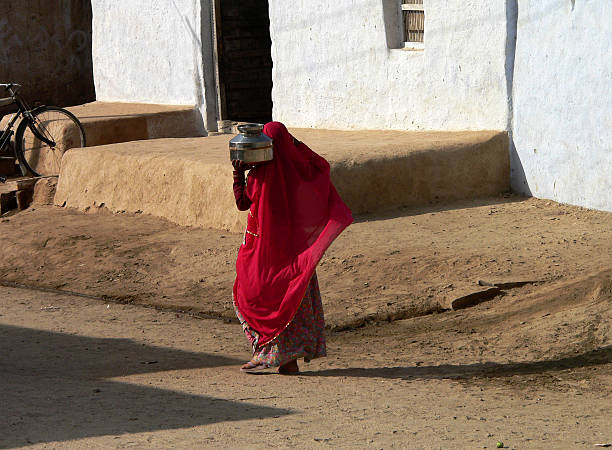 istock Woman in red sari -  Thar desert, Rajasthan, India. 89943475