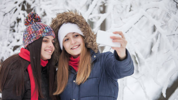 istock Young women enjoying in snow 899434912
