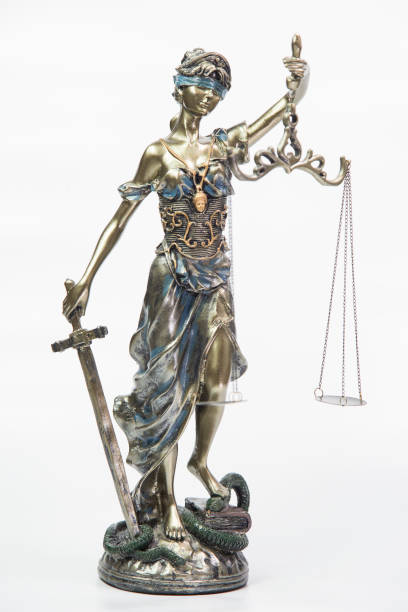 istock Statue of justice isolated on white background 899438246