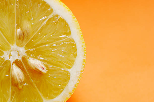 istock half of lemon against orange 89943833