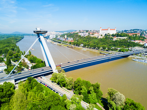 SNP New Bridge through Danude river aerial panoramic view in Bratislava. Bratislava is a capital of Slovakia.