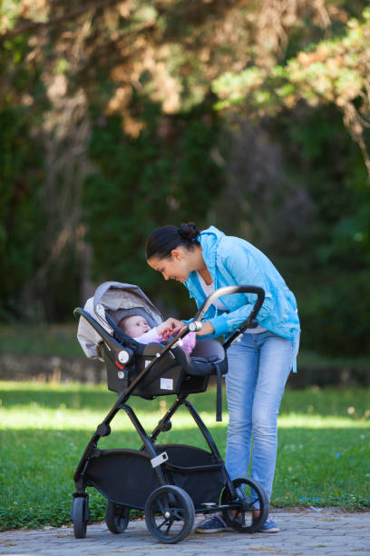 istock baby and mother in park 899450848