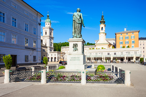 Mozart monument statue at the Mozartplatz square in Salzburg, Austria. Wolfgang Amadeus Mozart was a influential austrian composer of the classical era.
