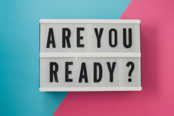 istock Are you ready - text on a display on blue and pink bright background. 899454128