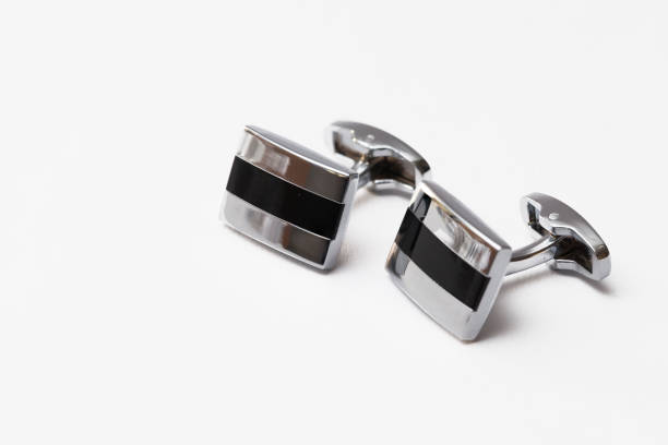 cufflinks silver cufflinks silver on white backgrounds, close up cufflink stock pictures, royalty-free photos & images