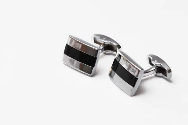 cufflinks silver on white backgrounds, close up