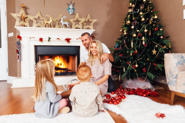 istock Happy Family With Chritsmas Tree 899461336