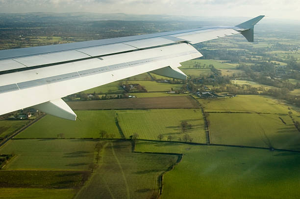 istock Wing of a Boeing 737 above Englands green fields 89946553