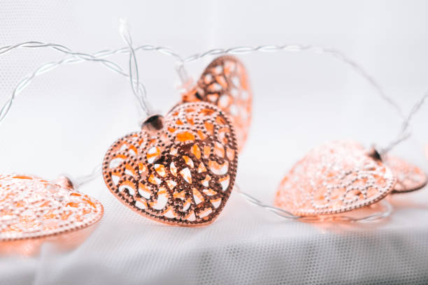 istock Rose gold heart shaped lightings 899468462