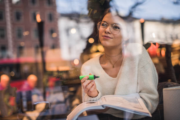 young female sudent learning in coffee shop. - muse indoors lifestyles education imagens e fotografias de stock