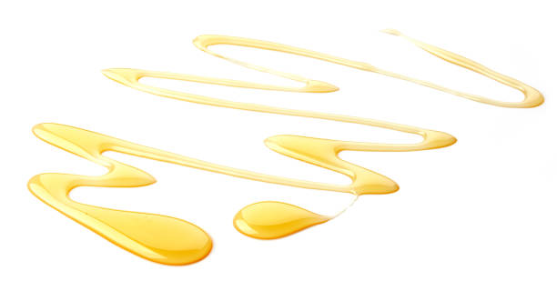 istock honey isolated on white background 899479884