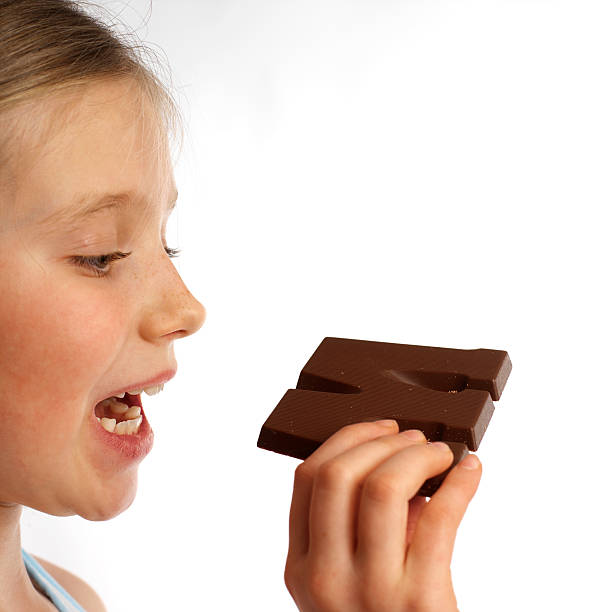 istock girl eating chocolate 89948280