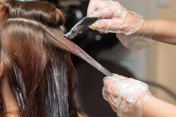 istock hair coloring in a beauty salon 899486448