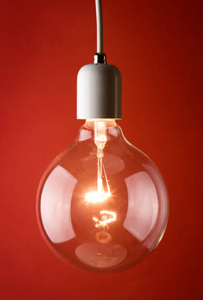 Tungsten light bulb Tungsten light bulb light bulb filament photos stock pictures, royalty-free photos & images