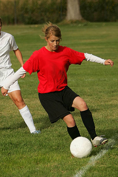 istock Young Female Soccer Player in Red Makes Sideline Save 89949489
