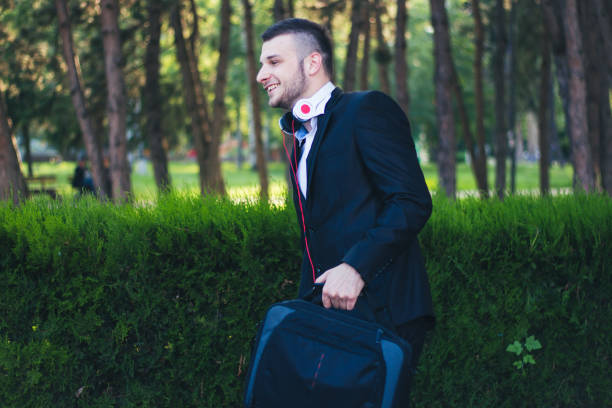 istock Young businessmen walking through the park 899500146
