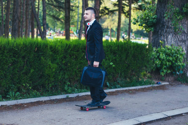 istock businessman on a skateboard 899500550