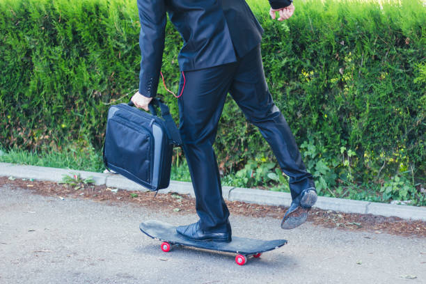 istock businessman on a skateboard 899500854
