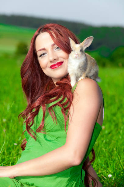 istock Beautiful girl with rabbit 899502196