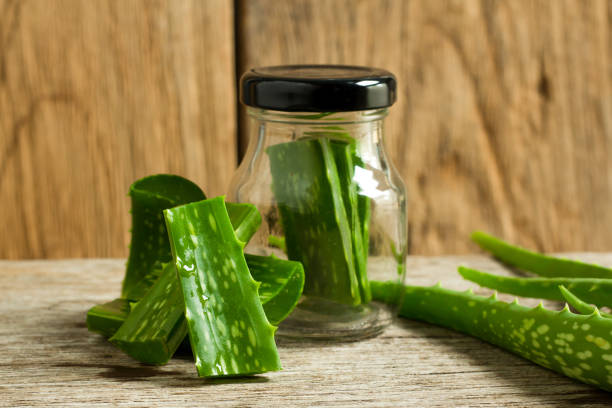 istock Aloe vera herb on wooden floor 899504008