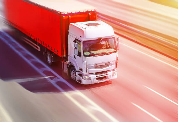 istock truck moves on highway 899506366