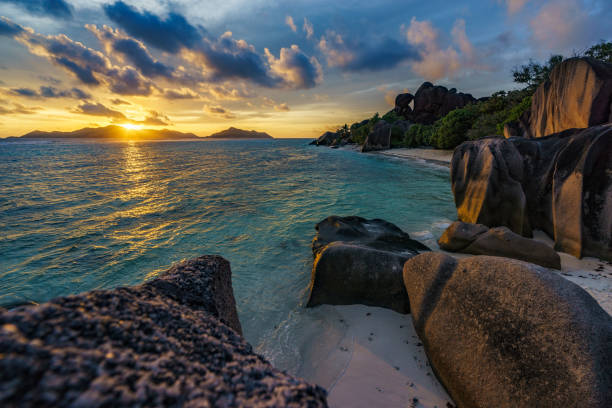 istock sunset at paradise beach,silver spring cove,the dike,seychelles 1 899506686