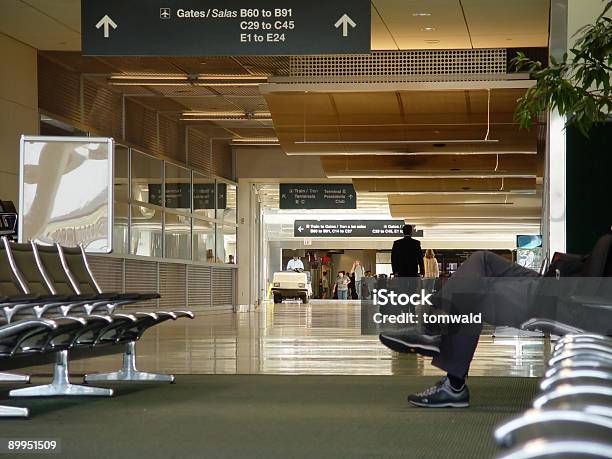 Waiting At The Houston Airport Stock Photo - Download Image Now - Adult, Airport, Cart