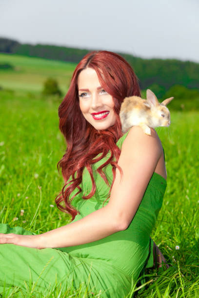 istock Beautiful girl with rabbit 899520936