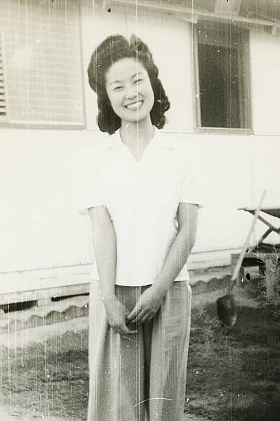 istock Smiling Asian Woman Outside her Home 89952280