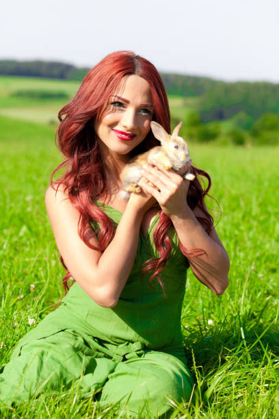 istock Beautiful girl with rabbit 899525926