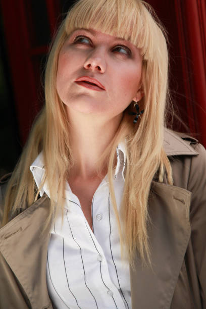 istock blond woman looking up 899528996