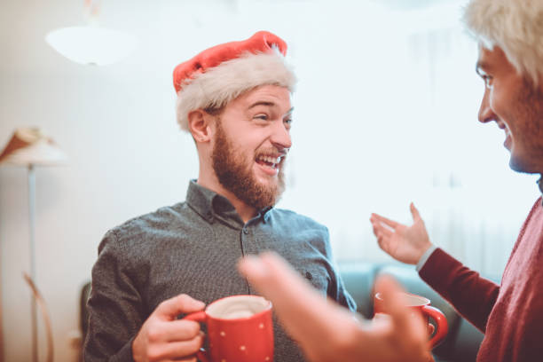 istock Two Smiling Drunk Friends Having a Funny Christmas Celebration 899529140