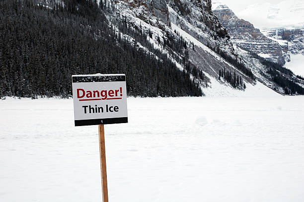 istock Danger warning signpost on a frozen Lake Louise,Alberta,Canada 89953875