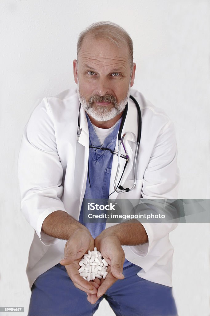 doctor offering pills  Adult Stock Photo