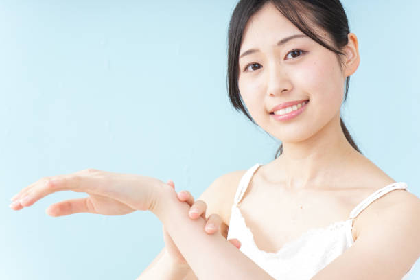 istock Young woman applying a cream 899556298