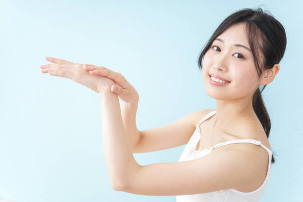 istock Young woman applying a cream 899556300