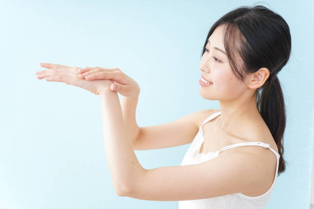 istock Young woman applying a cream 899556344