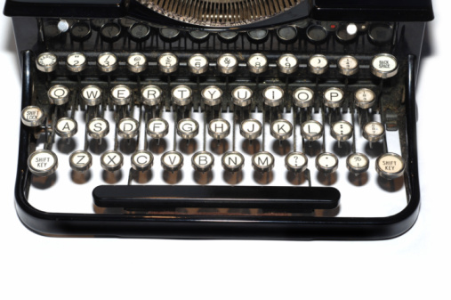 top down view on old vintage typewriter keyboard on wooden table