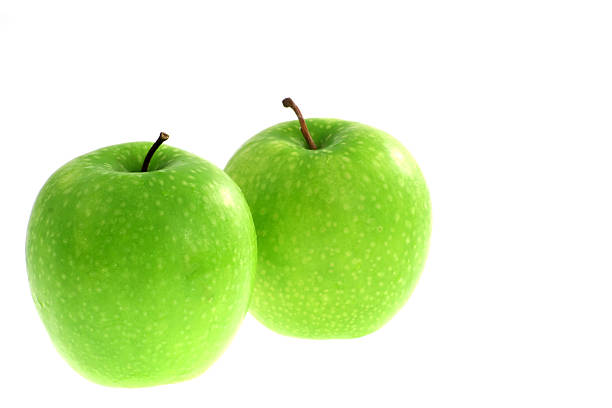 Two green healthy apples stock photo